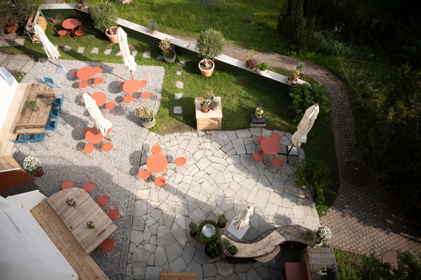 Aerial view of the villa's garden terrace with parasols